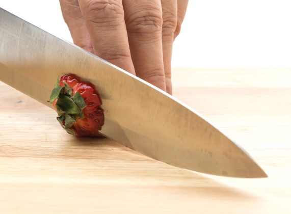 strawberry slice on wood board